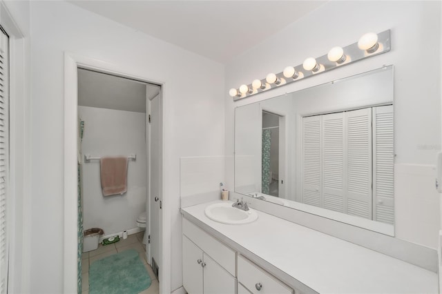 13207 SW Williston Rd, Micanopy, FL 32667 - bathroom with a closet, toilet, vanity, and tile patterned flooring