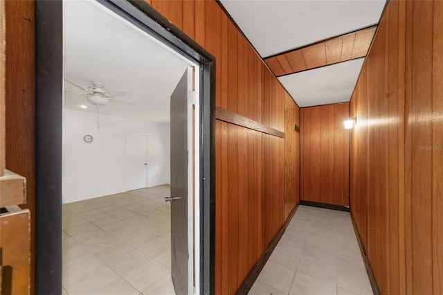 13207 SW Williston Rd, Micanopy, FL 32667 - hallway featuring wood walls and light tile patterned floors