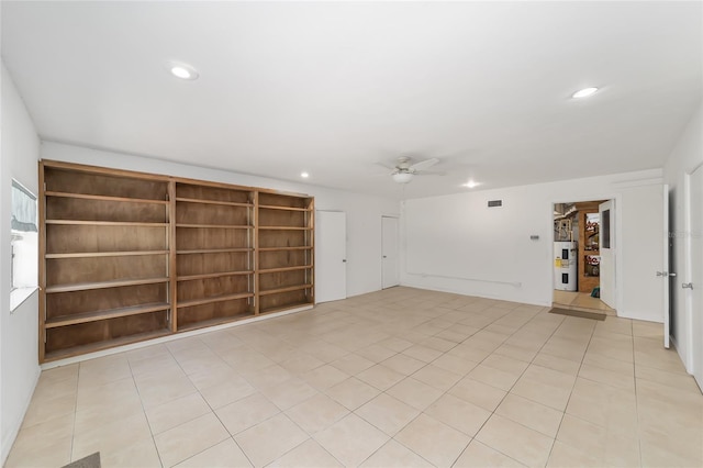 13207 SW Williston Rd, Micanopy, FL 32667 - unfurnished room featuring electric water heater, a ceiling fan, recessed lighting, and light tile patterned floors