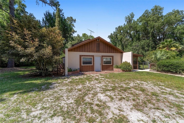 13207 SW Williston Rd, Micanopy, FL 32667 - view of front of house with board and batten siding