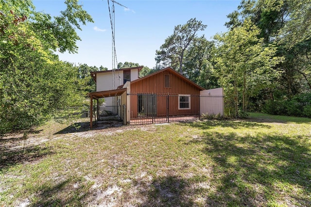 13207 SW Williston Rd, Micanopy, FL 32667 - rear view of house with board and batten siding