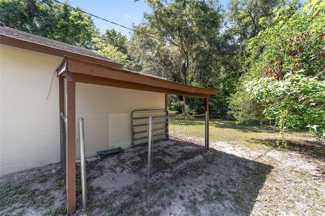 13207 SW Williston Rd, Micanopy, FL 32667 - view of yard with an attached carport