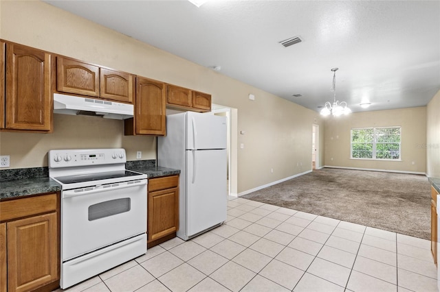 1573 NW 29th Rd Unit 2, Gainesville, FL 32605 - kitchen with white appliances, under cabinet range hood, light carpet, dark countertops, and a chandelier