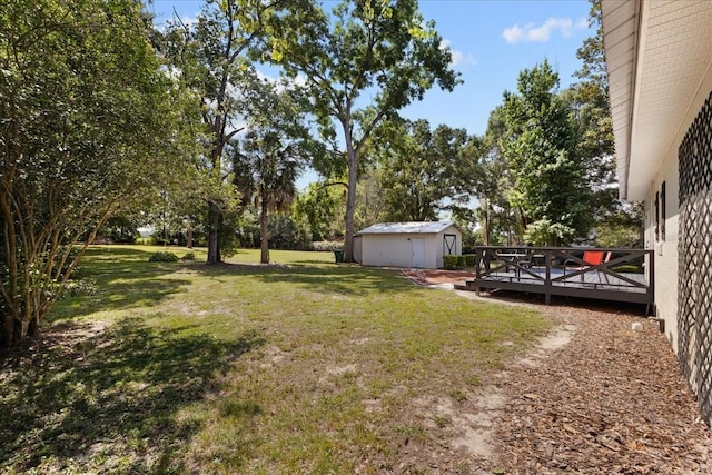 914 S Main St, Trenton, FL 32693 - view of grassy yard with a wooden deck and view of scattered trees