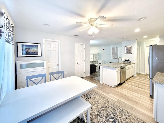 4000 SW 23rd St Unit 3-305, Gainesville, FL 32608 - kitchen featuring stainless steel appliances, light wood-style flooring, ceiling fan, recessed lighting, and a sink