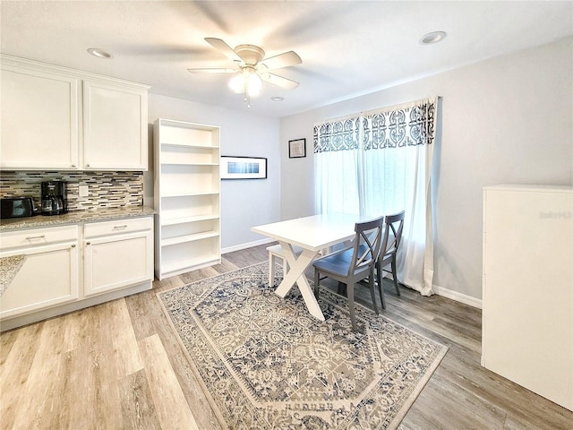 4000 SW 23rd St Unit 3-305, Gainesville, FL 32608 - dining area featuring ceiling fan, light wood finished floors, and baseboards