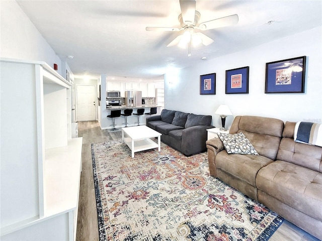 4000 SW 23rd St Unit 3-305, Gainesville, FL 32608 - living area featuring light wood-style flooring and ceiling fan