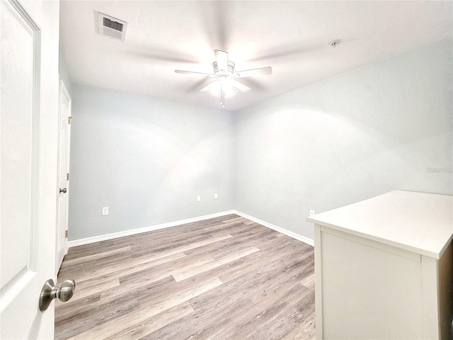 4000 SW 23rd St Unit 3-305, Gainesville, FL 32608 - empty room featuring a ceiling fan, light wood finished floors, baseboards, and a pendent fire sprinkler