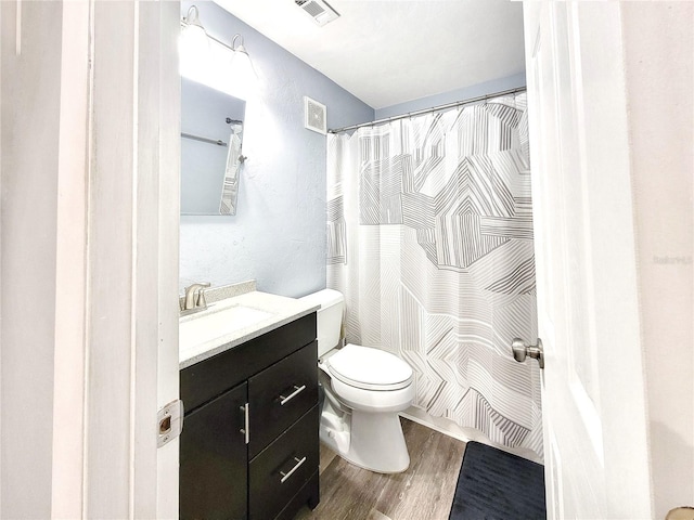 4000 SW 23rd St Unit 3-305, Gainesville, FL 32608 - full bath with wood finished floors, vanity, toilet, and curtained shower