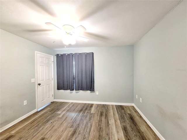4000 SW 23rd St Unit 3-305, Gainesville, FL 32608 - empty room with wood finished floors, baseboards, and ceiling fan