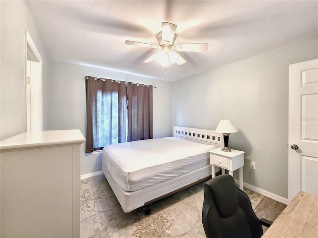 4000 SW 23rd St Unit 3-305, Gainesville, FL 32608 - bedroom with baseboards and a ceiling fan