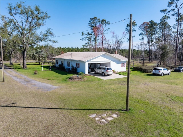 1058 NW County Road 290, Mayo, FL 32066 - view of front of property with an attached garage, a front yard, driveway, and a chimney