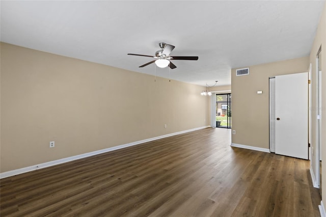 2300 SW 43rd St Unit Q2, Gainesville, FL 32607 - unfurnished room with dark wood-style floors, ceiling fan, baseboards, and a chandelier