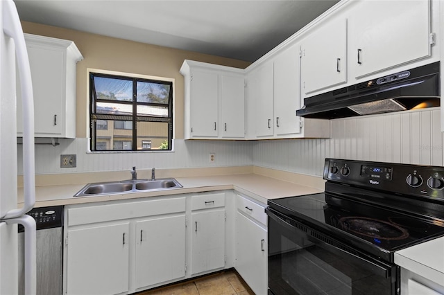 2300 SW 43rd St Unit Q2, Gainesville, FL 32607 - kitchen with black electric range oven, a sink, under cabinet range hood, and white cabinets