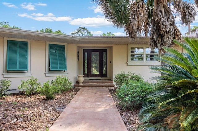 20031 NW County Road 236, High Springs, FL 32643 - doorway to property featuring stucco siding and crawl space