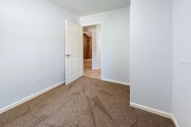 3046 SE 134th St, Starke, FL 32091 - unfurnished room featuring carpet flooring and baseboards