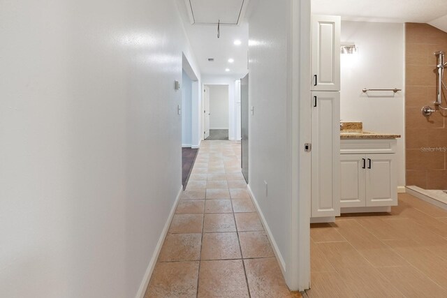 3046 SE 134th St, Starke, FL 32091 - hallway with attic access, baseboards, recessed lighting, and light tile patterned floors