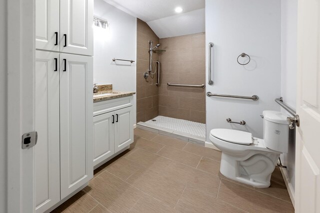 3046 SE 134th St, Starke, FL 32091 - bathroom featuring toilet, a tile shower, vanity, and lofted ceiling