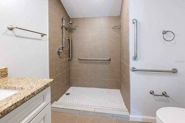 3046 SE 134th St, Starke, FL 32091 - bathroom with toilet, a tile shower, and vanity