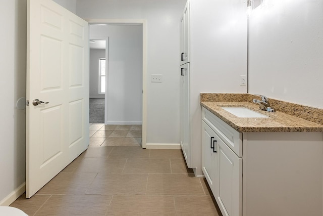 3046 SE 134th St, Starke, FL 32091 - bathroom featuring vanity, baseboards, and tile patterned floors