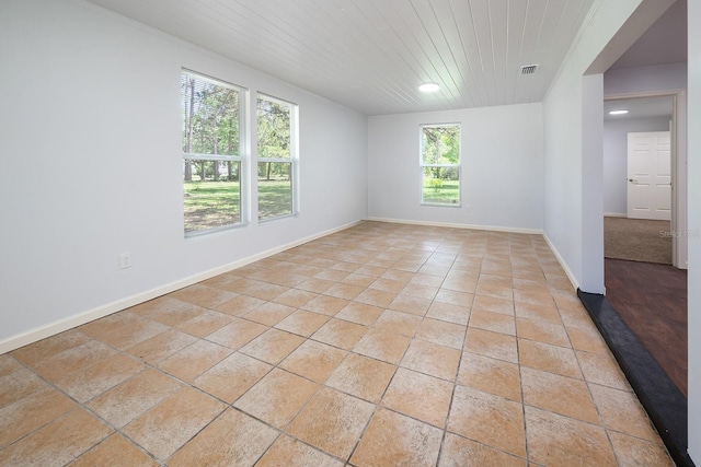3046 SE 134th St, Starke, FL 32091 - unfurnished room with wood ceiling, baseboards, and recessed lighting