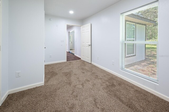3046 SE 134th St, Starke, FL 32091 - carpeted empty room with healthy amount of natural light, baseboards, and recessed lighting