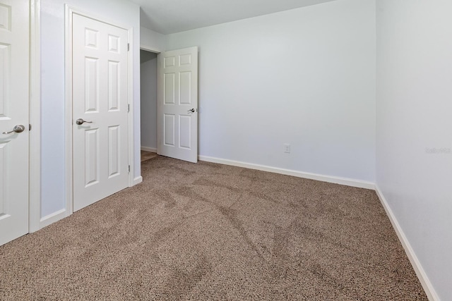 3046 SE 134th St, Starke, FL 32091 - unfurnished bedroom featuring carpet flooring and baseboards