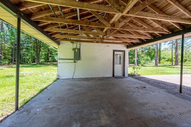 3046 SE 134th St, Starke, FL 32091 - garage featuring a carport and electric panel