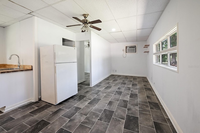 3046 SE 134th St, Starke, FL 32091 - kitchen with freestanding refrigerator, a sink, ceiling fan, a drop ceiling, and recessed lighting