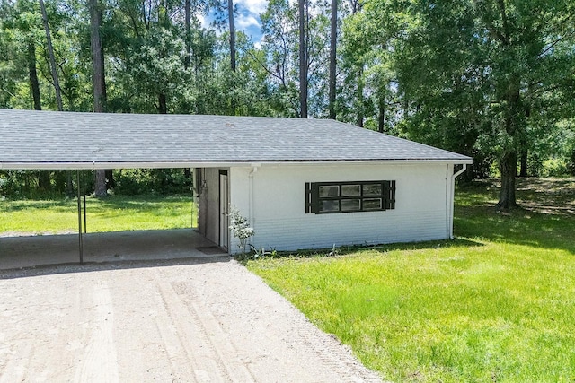 3046 SE 134th St, Starke, FL 32091 - view of outdoor structure with dirt driveway, an attached carport, and view of wooded area