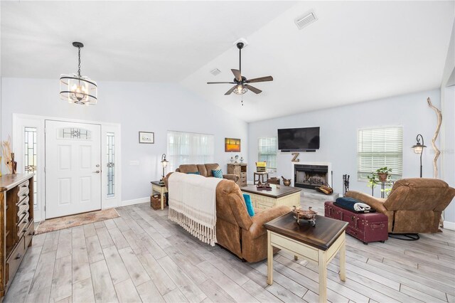 11001 225th Rd, Live Oak, FL 32060 - living area featuring light wood-type flooring, healthy amount of natural light, a ceiling fan, a chandelier, and high vaulted ceiling