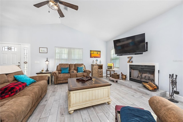 11001 225th Rd, Live Oak, FL 32060 - living area with high vaulted ceiling, ceiling fan, light wood-style floors, and a fireplace with raised hearth