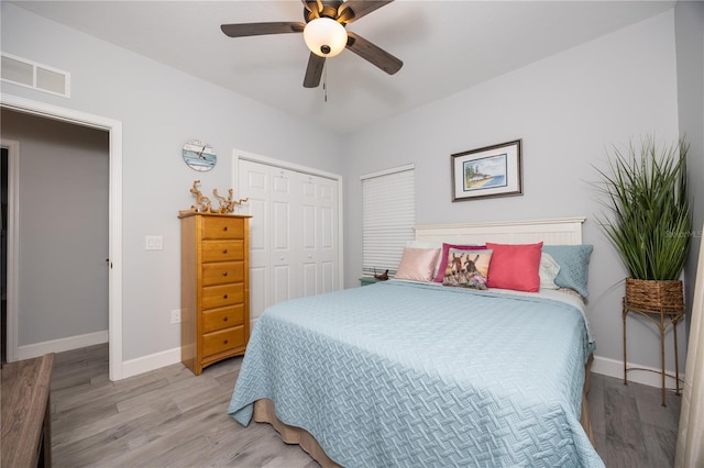 11001 225th Rd, Live Oak, FL 32060 - bedroom featuring baseboards, light wood-type flooring, a closet, and a ceiling fan