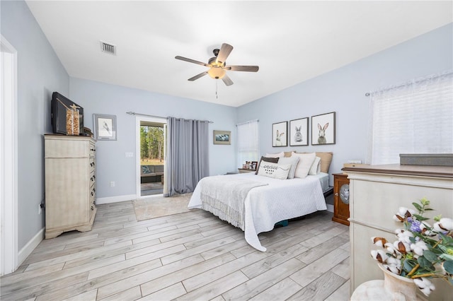 11001 225th Rd, Live Oak, FL 32060 - bedroom with light wood finished floors, access to exterior, baseboards, and a ceiling fan