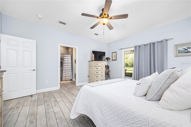 11001 225th Rd, Live Oak, FL 32060 - bedroom with light wood-style flooring, baseboards, ceiling fan, and ensuite bathroom