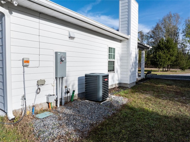 11001 225th Rd, Live Oak, FL 32060 - view of side of property featuring cooling unit and a chimney