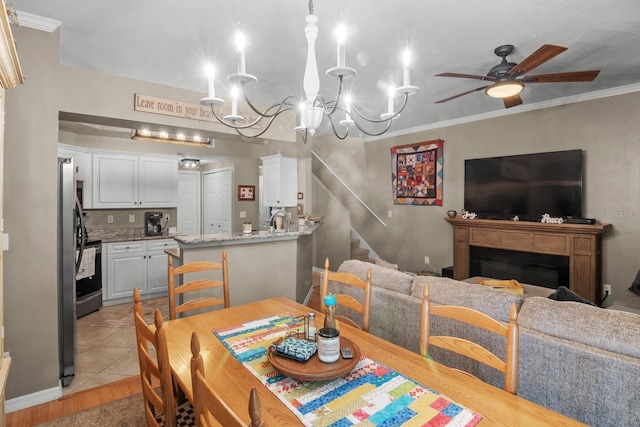 dining area with ceiling fan, stairway, a chandelier, crown molding, and light tile patterned floors