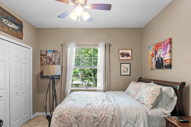bedroom with carpet flooring, a closet, a ceiling fan, and baseboards