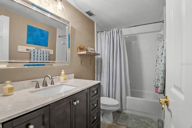 full bathroom with toilet, vanity, shower / tub combo with curtain, and a textured wall