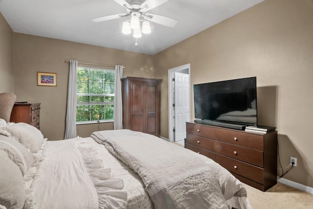 bedroom with carpet, baseboards, and a ceiling fan