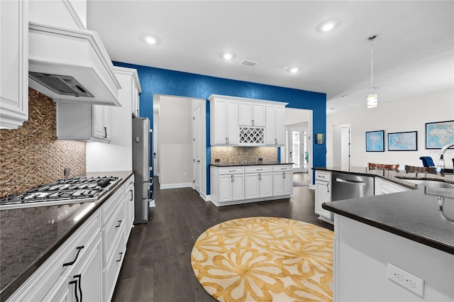 1084 NW 134th Way, Newberry, FL 32669 - kitchen featuring a sink, dark countertops, custom range hood, appliances with stainless steel finishes, and dark wood-type flooring