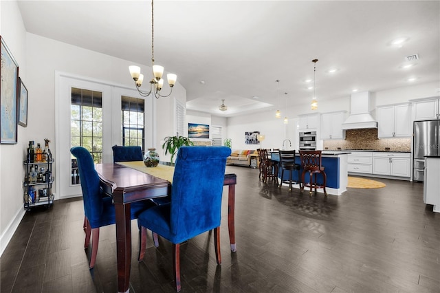 1084 NW 134th Way, Newberry, FL 32669 - dining space with dark wood finished floors, a chandelier, recessed lighting, and baseboards