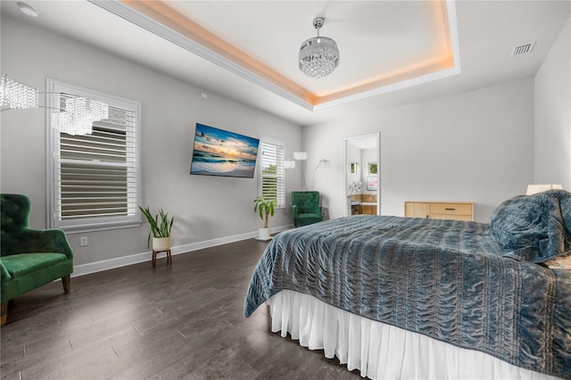1084 NW 134th Way, Newberry, FL 32669 - bedroom with a raised ceiling, dark wood-style floors, and baseboards