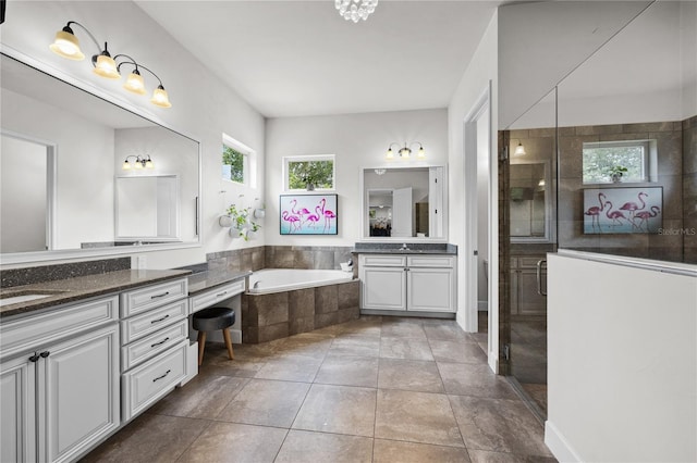 1084 NW 134th Way, Newberry, FL 32669 - full bath featuring two vanities, a bath, and a stall shower