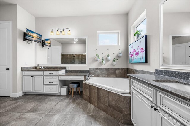 1084 NW 134th Way, Newberry, FL 32669 - full bathroom featuring two vanities, a garden tub, and tiled shower