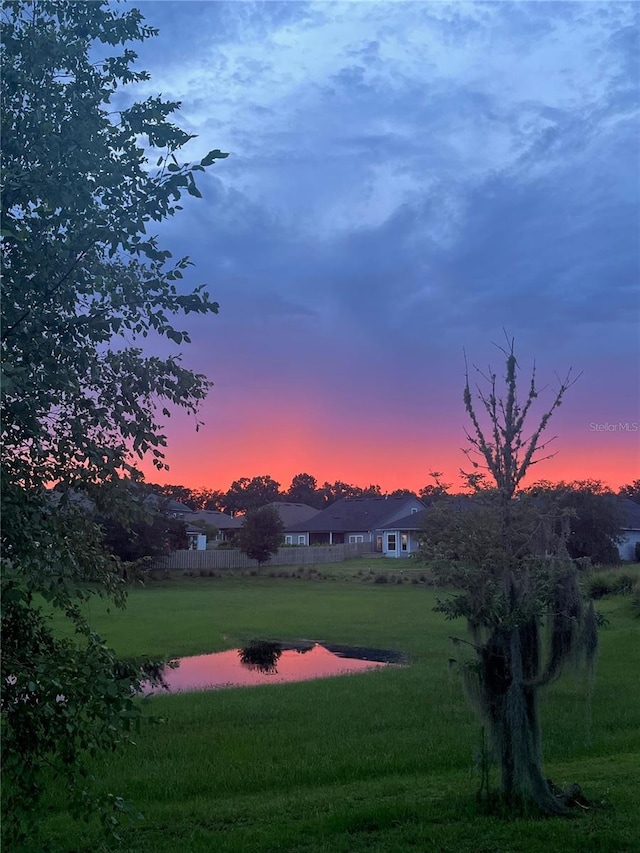 1084 NW 134th Way, Newberry, FL 32669 - view of community featuring a lawn and a water view