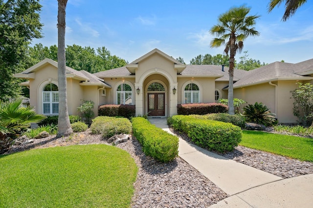 3533 SW 87th Dr, Gainesville, FL 32608 - mediterranean / spanish home featuring french doors, stucco siding, and a front yard