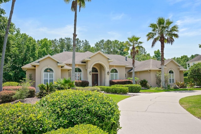 3533 SW 87th Dr, Gainesville, FL 32608 - view of front of home with stucco siding and curved driveway