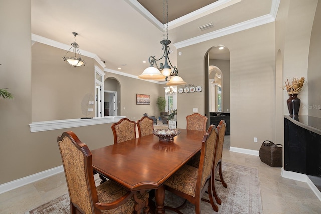 3533 SW 87th Dr, Gainesville, FL 32608 - dining area with arched walkways, ornamental molding, baseboards, and recessed lighting
