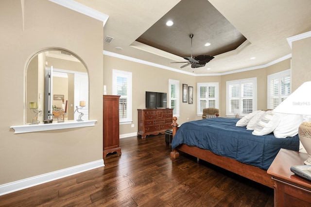 3533 SW 87th Dr, Gainesville, FL 32608 - bedroom featuring a raised ceiling, hardwood / wood-style floors, baseboards, multiple windows, and crown molding
